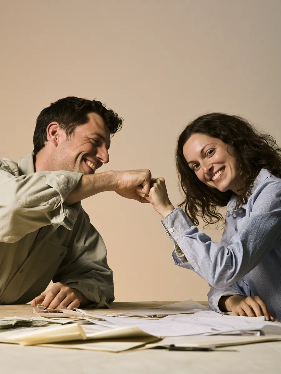 American couple celebrating the simplicity of one consolidated loan payment